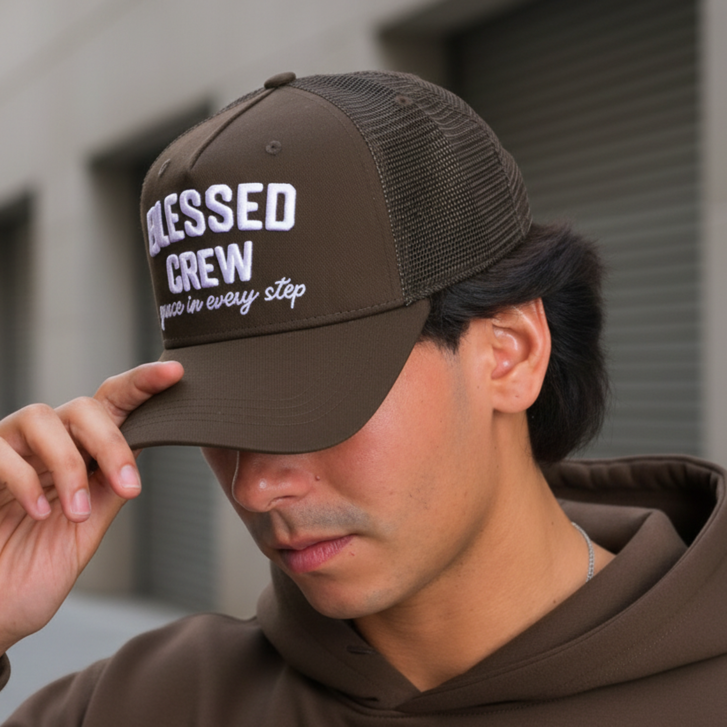 Close-up with smooth brown hoodie and BLESSED CREW hat